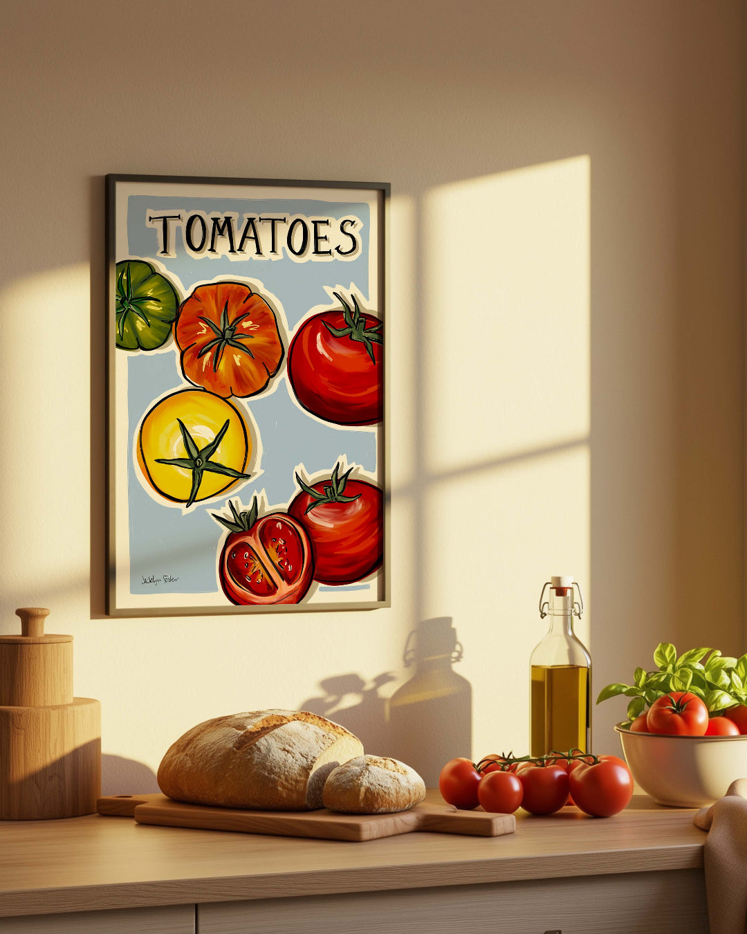 Kitchen counter with bread, tomatoes, and a 'Tomatoes' kitchen print on the wall.