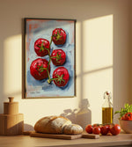 Kitchen counter with bread, tomatoes, and a painting of tomatoes on the wall.