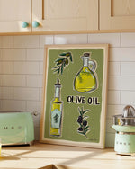 Kitchen with wooden cabinets, and a framed olive oil kitchen print.