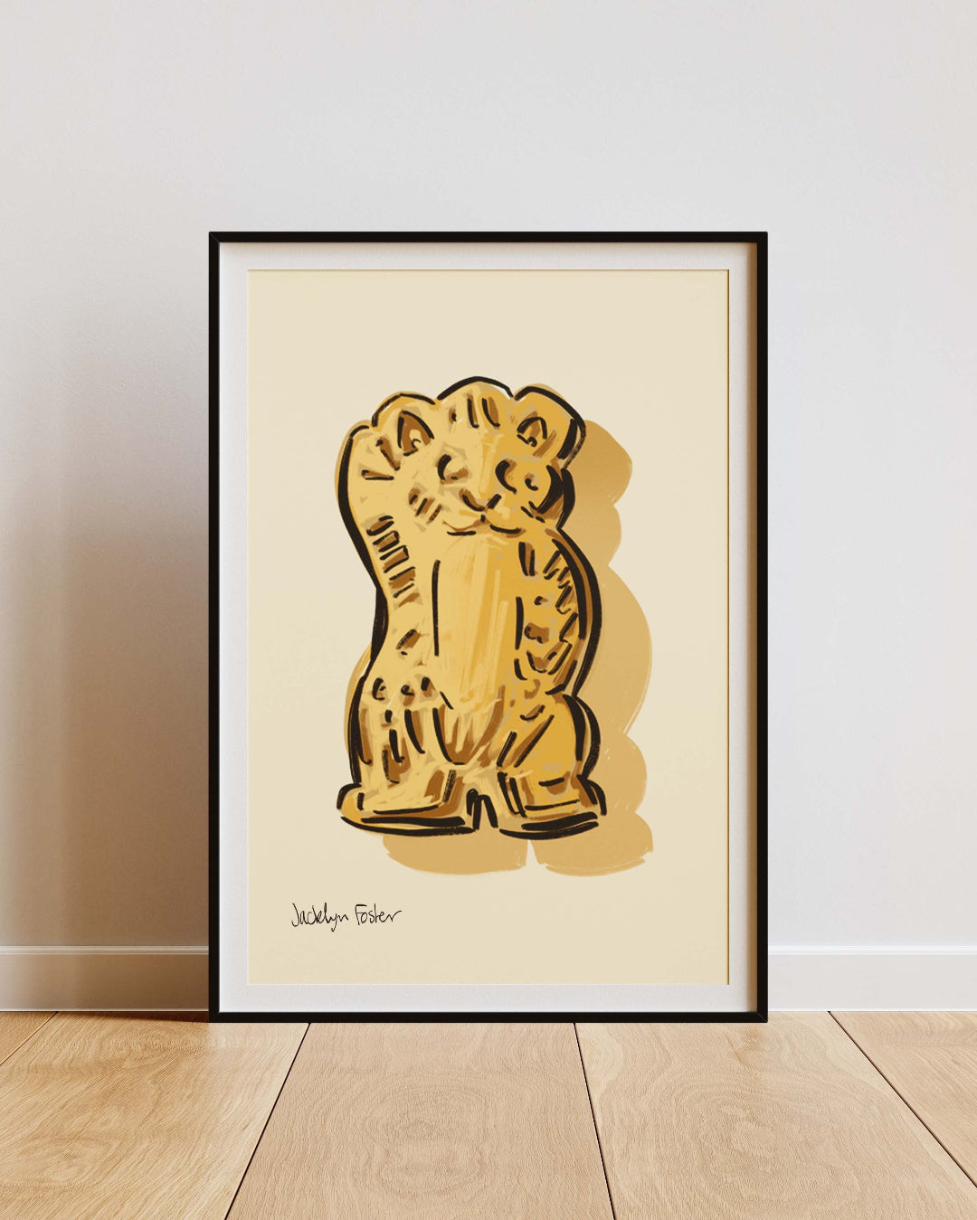 Framed artwork of a bear biscuit on a beige background